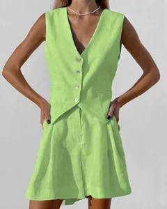 Lime green cotton-linen vest and shorts two-piece suit set showing fabric texture