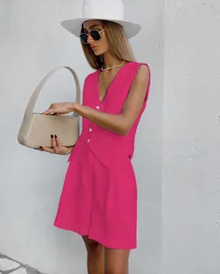 Elegant fuchsia linen vest and shorts two-piece set worn by model in summer sun.