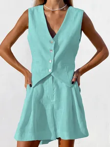 Close-up detail of a breathable linen vest and shorts two-piece set in mint blue.