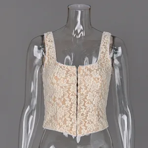 Detailed view of an elegant beige floral lace camisole top on a clear torso mannequin.