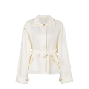 Detail of elegant white lapel frosted velvet trench coat with stylish waist belt