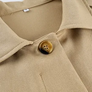 Close-up of khaki trench coat lapel with marble-textured button and fine fabric detail