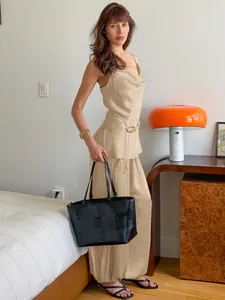 Elegant champagne satin two-piece set with camisole and wide-leg pants for women