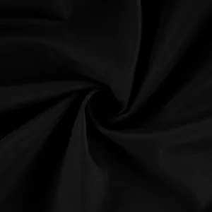 Vista macro dettagliata della trama del morbido tessuto intrecciato nero per pantaloni jogging