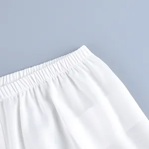 Detailed close-up view of the white elastic waistband on these casual straight-leg trousers
