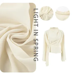 Detailed view of apricot chiffon blouse showing premium fabric texture and waist design