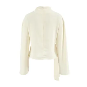 Back view of apricot chiffon blouse with invisible zipper and bell sleeves