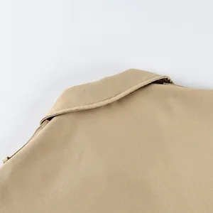 Close-up detail of a classic khaki lapel collar showing the fine twill fabric texture