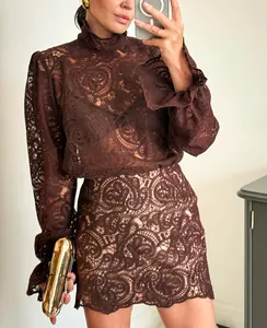 Elegant brown lace two-piece set featuring a long sleeve shirt and an A-line mini skirt.
