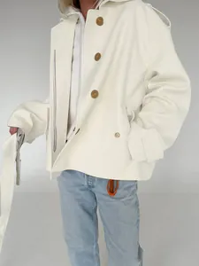 Detailed view of off-white frosted velvet jacket with lapels and oversized buttons