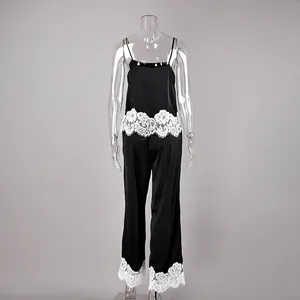 Detailed back view of black satin camisole and lace-trimmed pants loungewear set