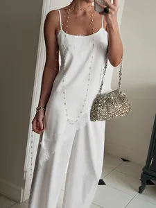 Chic white satin two-piece set with lace camisole and wide-leg trousers for women