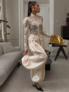 Elegant champagne satin lantern pants featuring a loose and comfortable casual fit