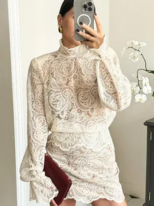 Elegant cream lace two-piece set with high-neck long sleeve top and A-line mini skirt