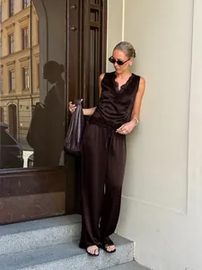 Elegant dark brown satin two-piece set with lace trim V-neck top and wide-leg trousers