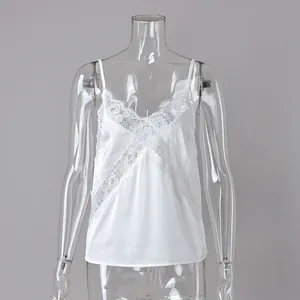 Elegant white lace patchwork camisole top displayed on a mannequin for summer fashion.