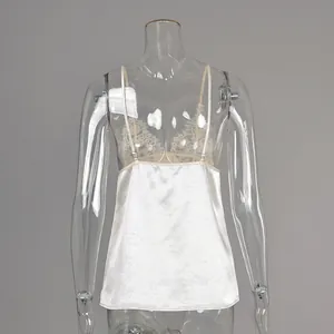 Back view detail of elegant white satin camisole with delicate eyelash lace trim
