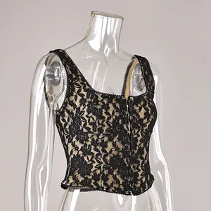 Close-up detail of sexy black floral lace camisole showing delicate embroidery and mesh texture