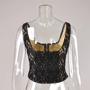 Back view of a black lace sleeveless crop top with beige lining on a clear mannequin.