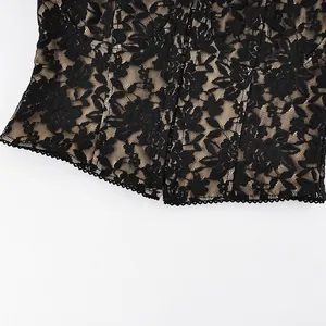 Detailed view of black floral lace corset top with elegant hook and eye closure