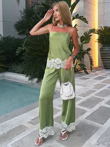 Elegant green satin two-piece set featuring lace camisole and wide-leg trousers for summer