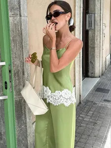 Stylish green satin camisole and pants set with white lace trim for women