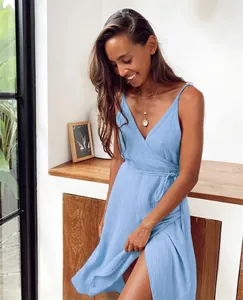 Detailed view of the light blue V-neck cotton crepe gauze wrap dress featuring a side slit