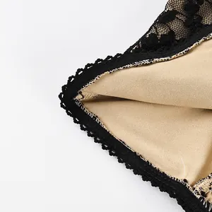 Close-up detail showing the fine stitching and black lace of a sexy camisole top with nude lining