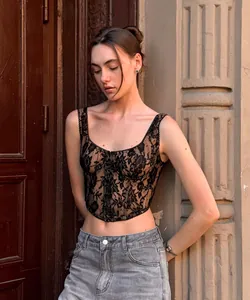 Close-up detail of an elegant black floral lace camisole top with corset style.