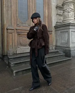 Elegant brown faux suede belted jacket for women shown in a vintage street style setting