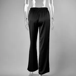 Back view of elegant black high-waisted satin straight-leg trousers on a mannequin