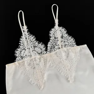 Detailed view of elegant cream lace V-neck camisole featuring delicate eyelash fringe