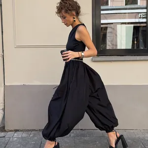 Detailed side view of chic black balloon pants captured in a stylish street fashion setting