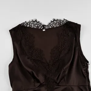 Close-up detail of deep V-neck lace trim on a dark brown satin camisole top.