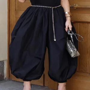 Stylish black high-waisted balloon pants for women with trendy oversized harem fit