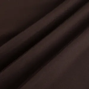 Close-up of the smooth dark brown satin fabric texture for straight-leg trousers.