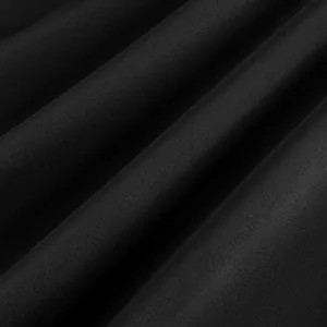 Macro shot of smooth black acetate satin fabric with fine diagonal twill texture.