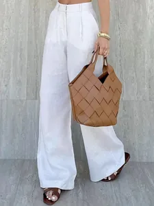 High-waisted elegant white wide-leg trousers for professional and casual summer wear