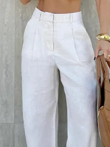 Minimalist high-waisted wide-leg linen trousers in beige for a chic commute style.