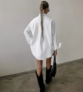 Minimalist white oversize boyfriend style shirt shown from back view for casual look