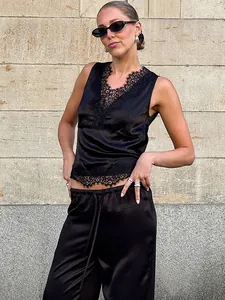 Elegant black satin two-piece set featuring lace trim V-neck top and straight pants