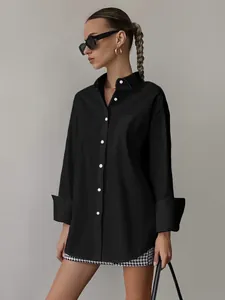 Detail view of oversized black boyfriend style long sleeve shirt for casual women's fashion