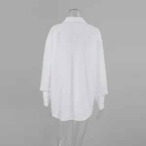 Back view of a minimalist white oversized boyfriend style shirt for women's casual wear