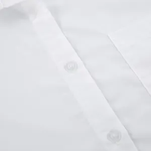 Detailed close-up view of a white boyfriend style shirt showing buttons and fabric texture