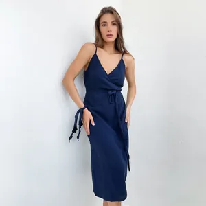 Detail of navy blue V-neck cotton gauze dress with tie-waist and side slit design