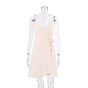 Elegant cream V-neck crepe wrap mini dress featuring thin spaghetti straps and tie waist