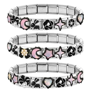 Detail view of stainless steel Italian charm bracelets with heart and animal charms.