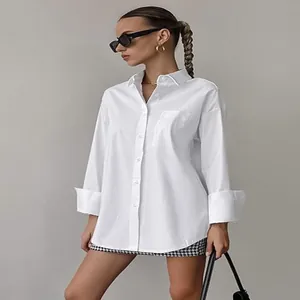 Minimalist white oversized boyfriend shirt for a stylish casual spring look
