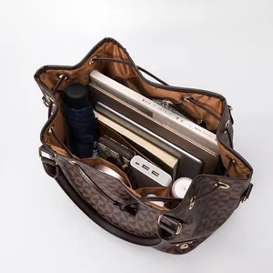 Large capacity checkered bucket bag showing interior storage for laptop and essentials