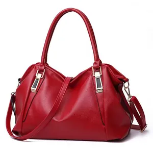 Elegant red pebble grain leather handbag with large capacity and gold hardware.